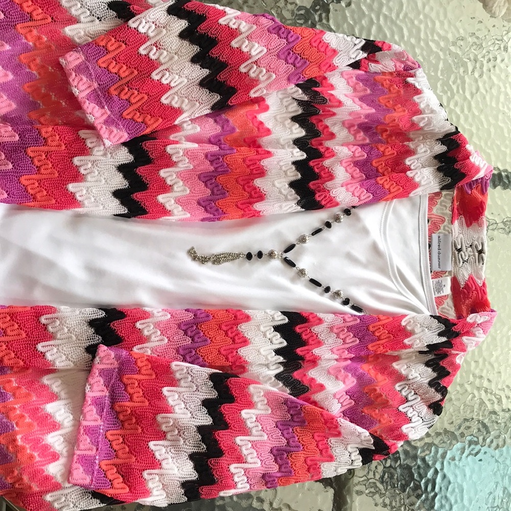 White blouse with attached cardigan and necklace.